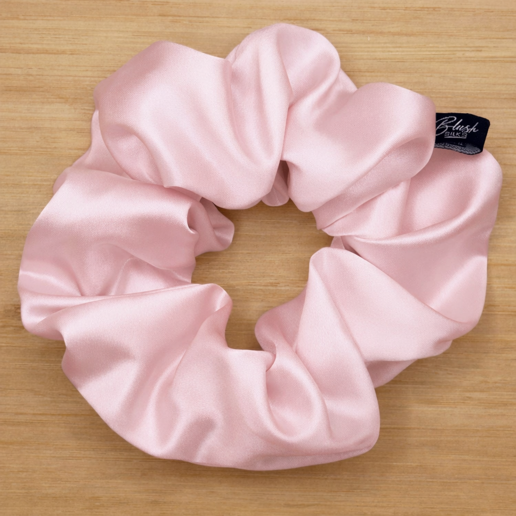 Signature blush pink classic silk scrunchie made of 22-momme 100% Mulberry silk.