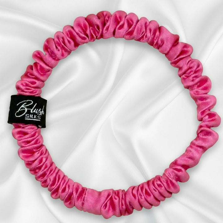 Vibrant bubblegum pink mini pure mulberry silk scrunchie for a fun, damage-free hairstyle.