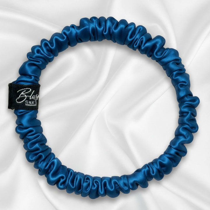 Vibrant cobalt blue mini pure mulberry silk scrunchie for a bold, damage-free ponytail.