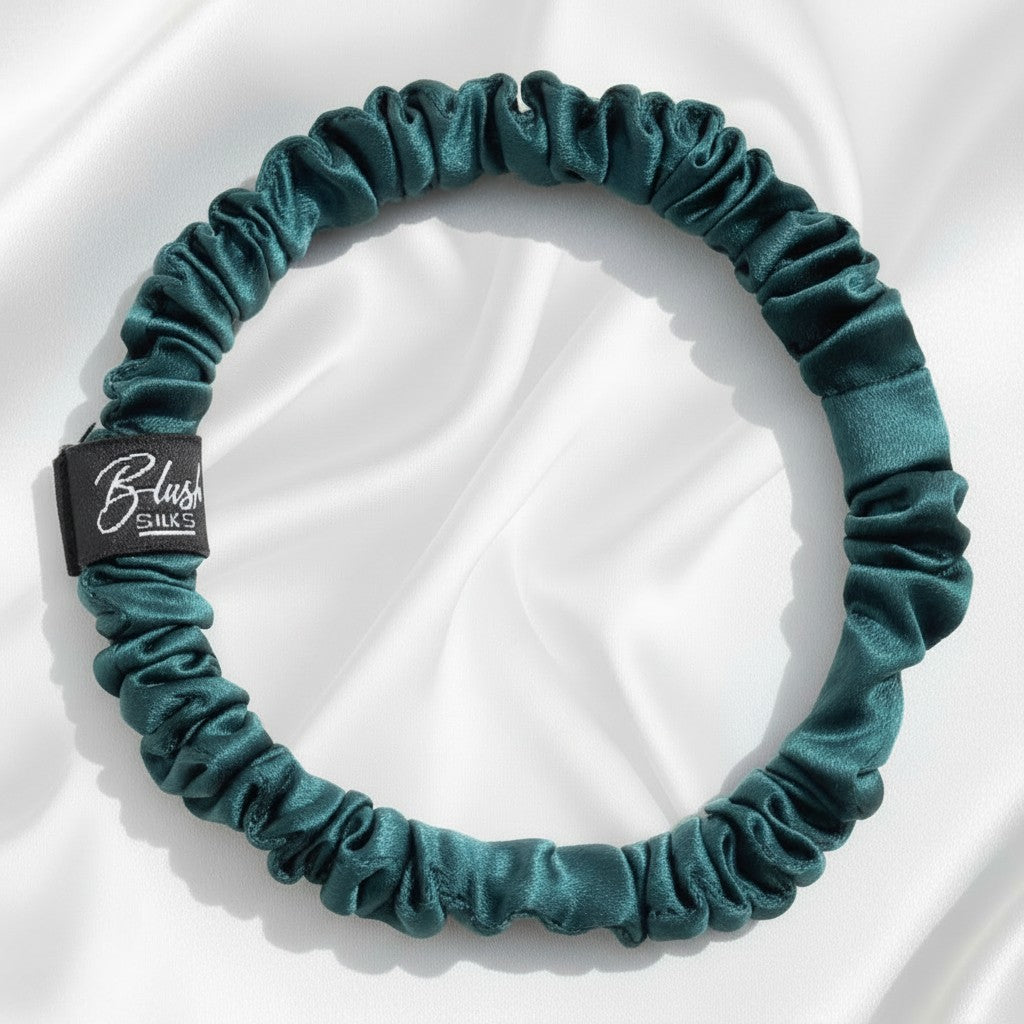 Emerald green mini pure mulberry silk scrunchie for a vibrant, damage-free jewel-toned hairstyle