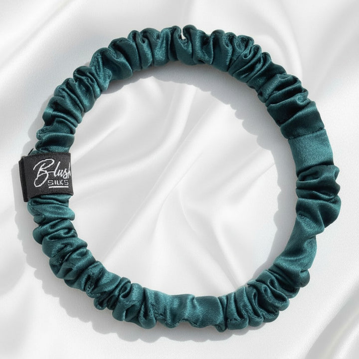 Emerald green mini pure mulberry silk scrunchie for a vibrant, damage-free jewel-toned hairstyle
