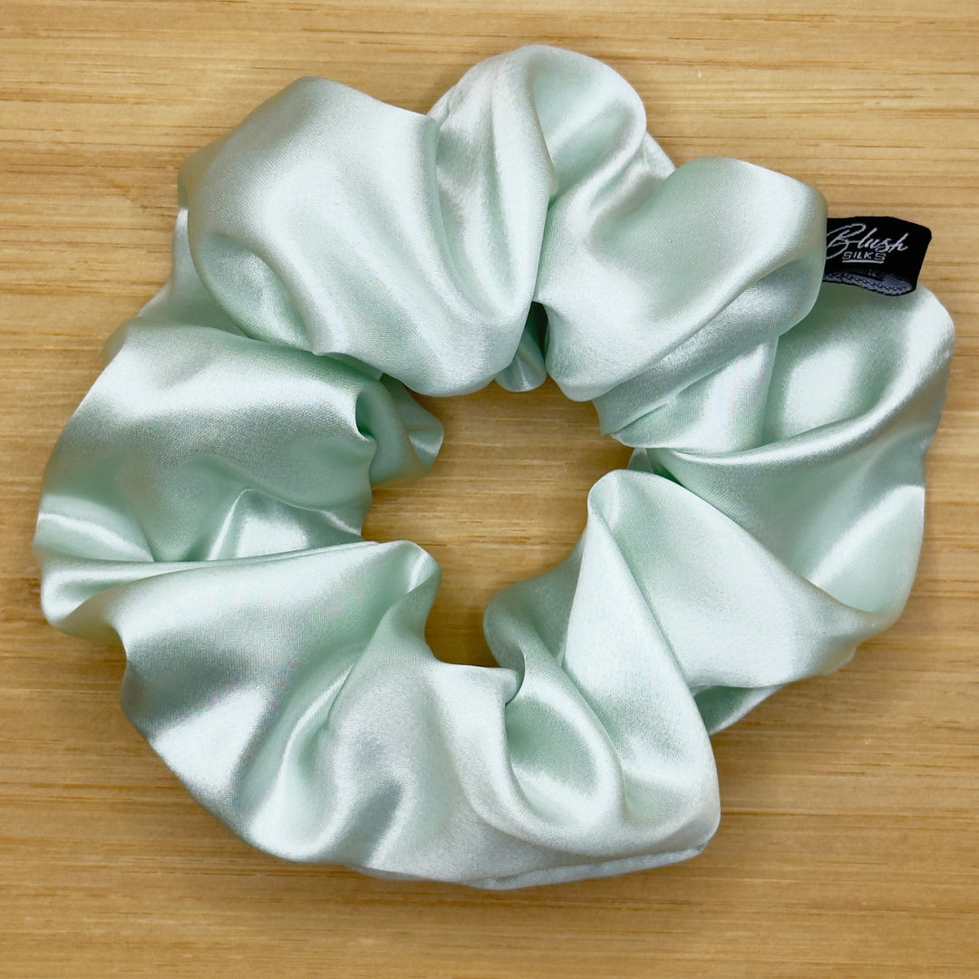 Mint green classic silk scrunchie in 22-momme Mulberry silk for frizz-free hair protection.