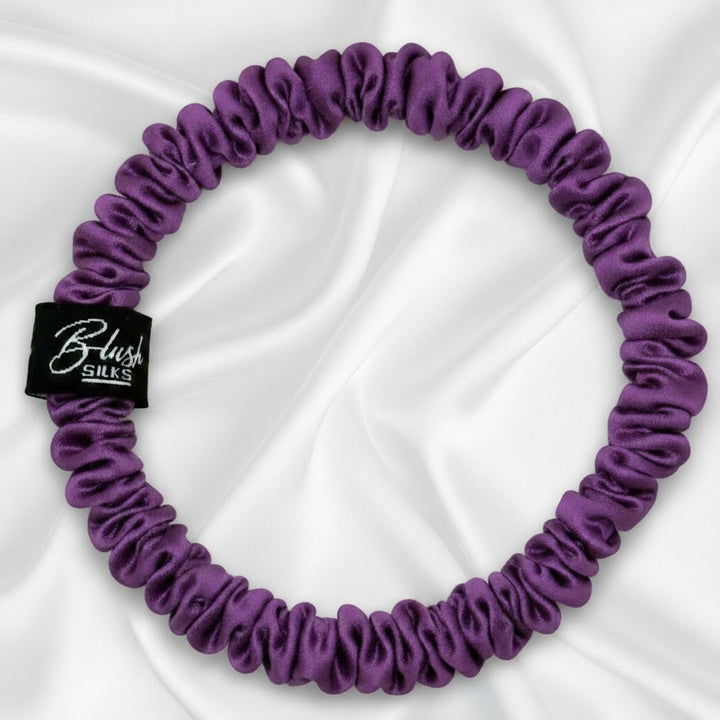 Vibrant purple mini pure mulberry silk scrunchie for a secure, damage-free royal purple hairstyle.