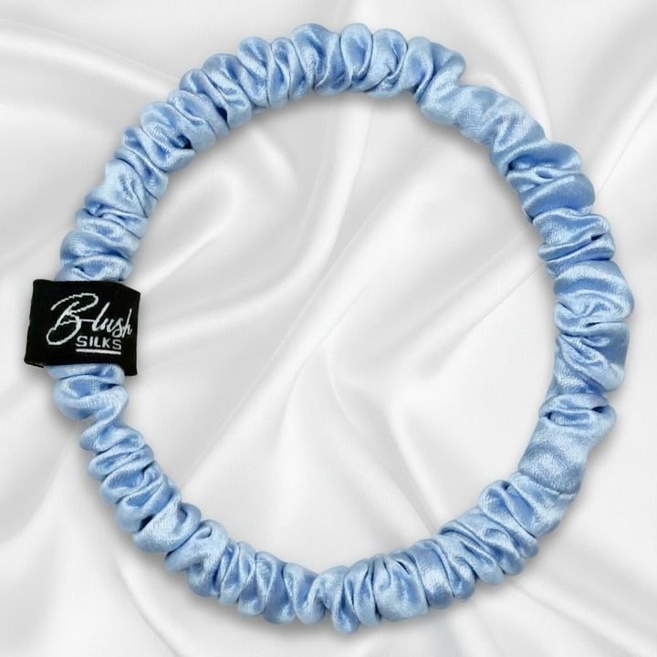 Soft sky blue mini pure mulberry silk scrunchie for a gentle, damage-free light blue hairstyle.
