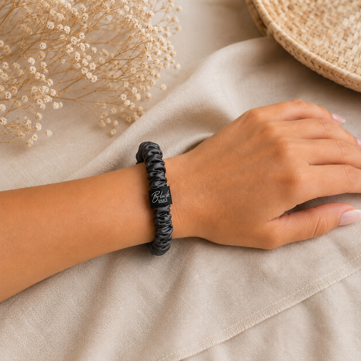 Charcoal Grey 100% mulberry silk mini scrunchie worn on wrist