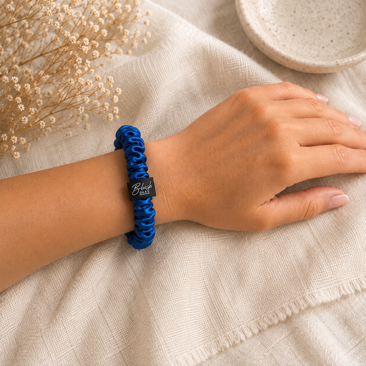 Cobalt Blue 100% mulberry silk mini scrunchie worn on wrist