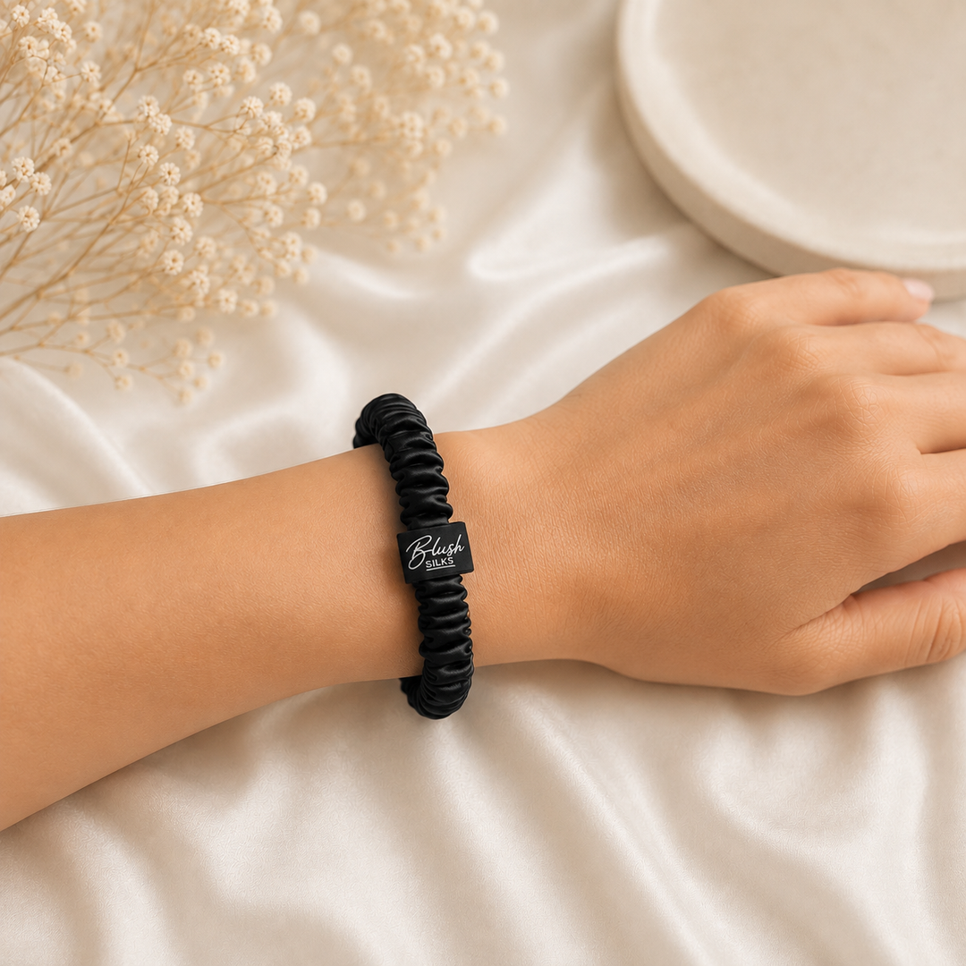 Blush Silks Onyx Black 100% mulberry silk mini scrunchie worn on wrist