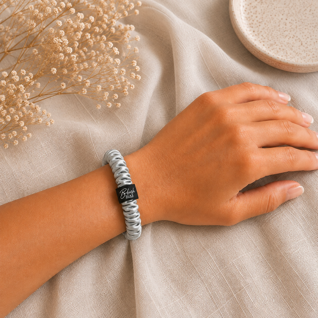 Pewter Grey 100% mulberry silk mini scrunchie worn on wrist