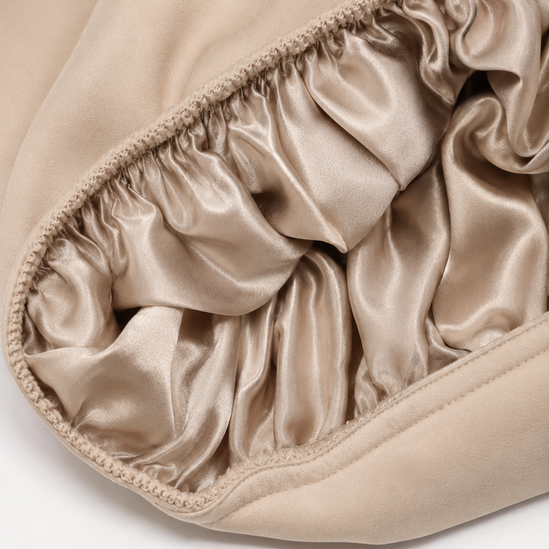 Inside view of cream mulberry silk sleep bonnet showing smooth 100% silk lining for protecting hair, reducing frizz, and retaining moisture by Blush Silks Canada