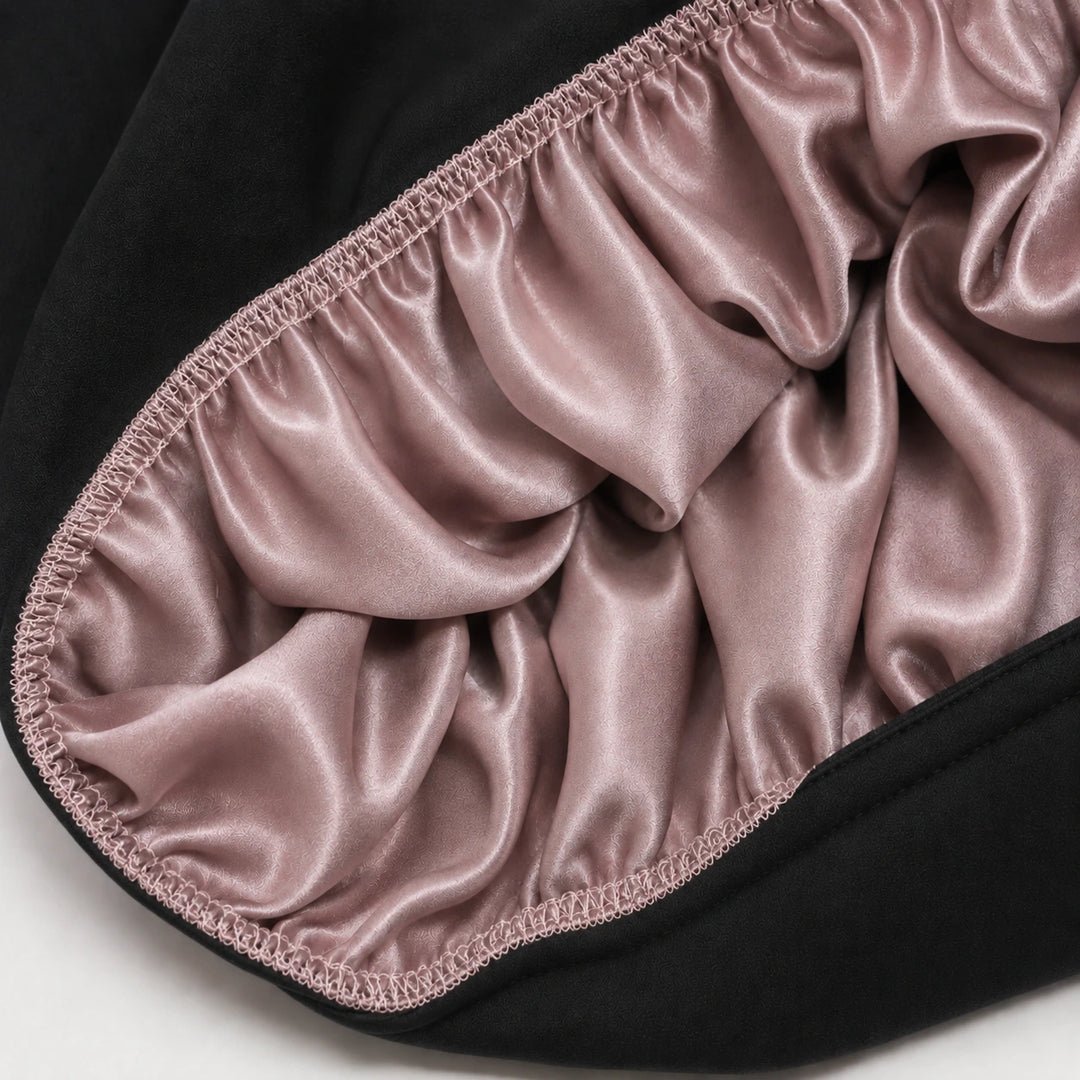 Inside view of dusty rose mulberry silk sleep bonnet showing smooth 100% silk lining for protecting hair, reducing frizz, and retaining moisture by Blush Silks Canada