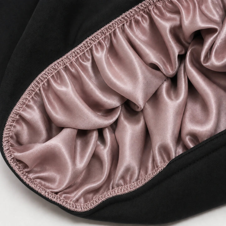 Inside view of dusty rose mulberry silk sleep bonnet showing smooth 100% silk lining for protecting hair, reducing frizz, and retaining moisture by Blush Silks Canada