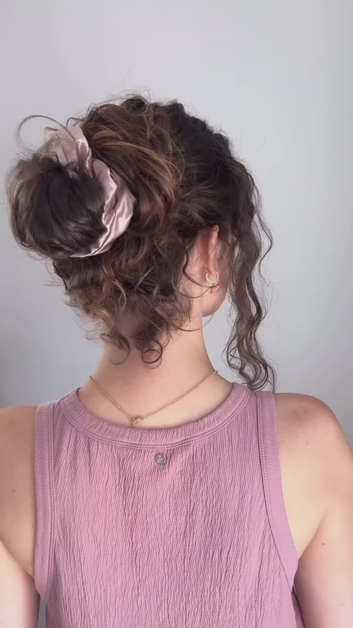 Lotus Oversized Mulberry Silk Scrunchie styled in a messy bun – Blush Silks
